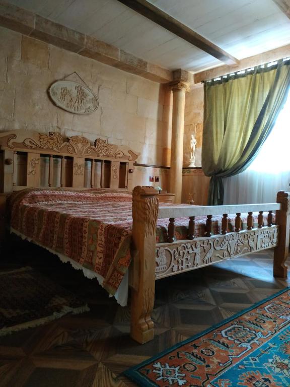 Postel nebo postele na pokoji v ubytování Hye Aspet Հայ Ասպետ
