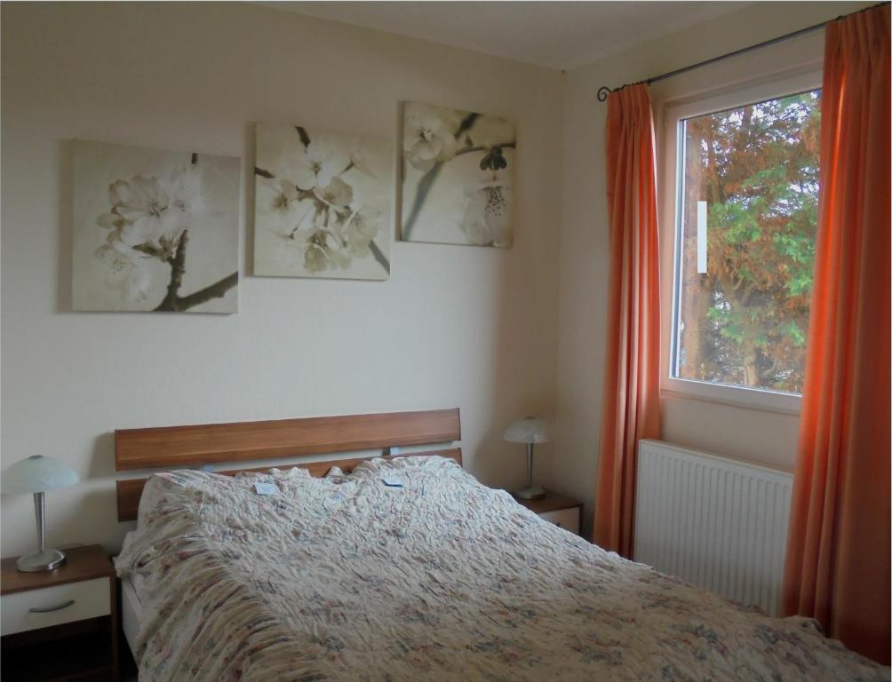 Postel nebo postele na pokoji v ubytování Haus zum Leuchtturm Ferienpark Vislust Niederlande Ijsselmeer