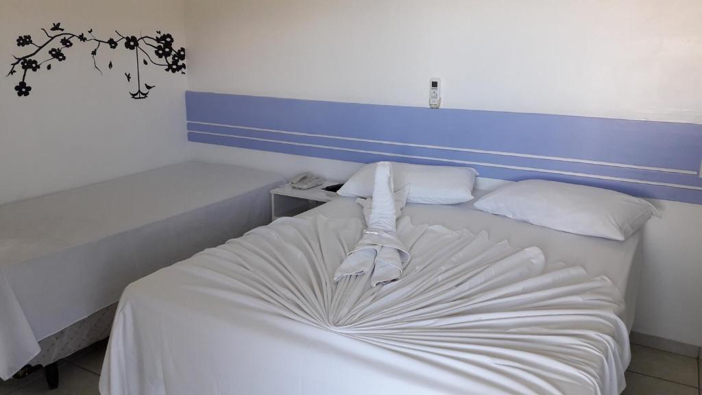 Postel nebo postele na pokoji v ubytování Hotel Ponta de Areia