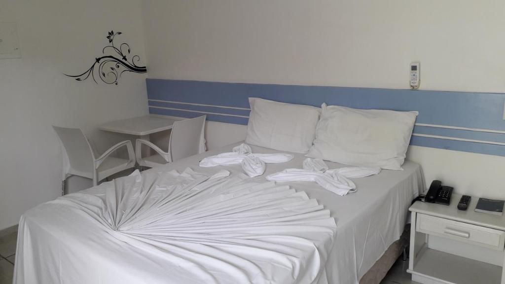 Postel nebo postele na pokoji v ubytování Hotel Ponta de Areia
