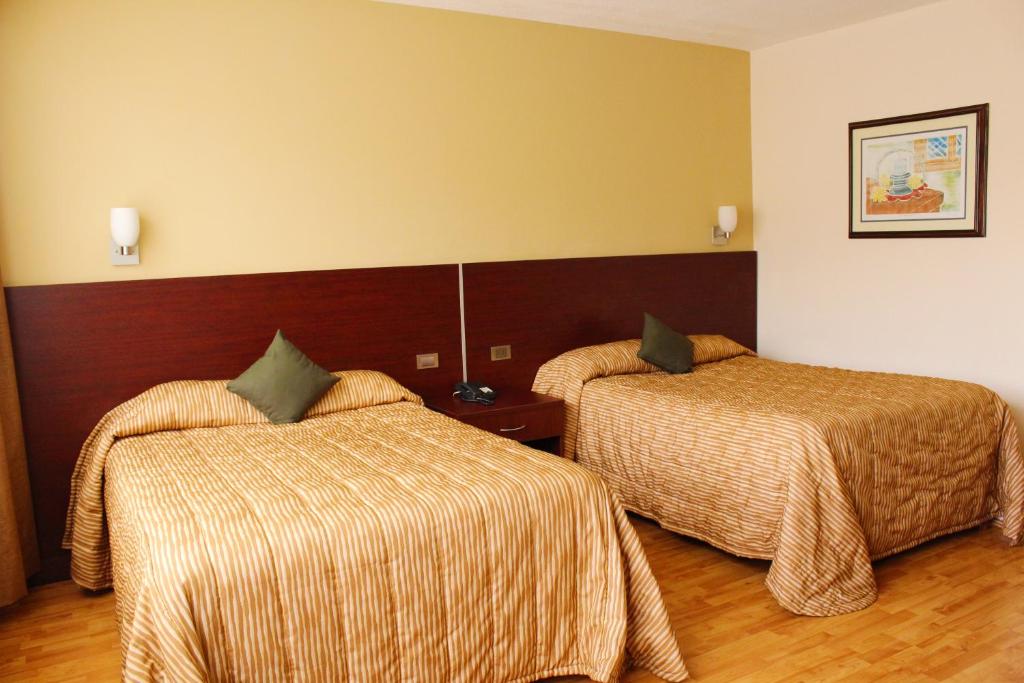 Ένα ή περισσότερα κρεβάτια σε δωμάτιο στο Don Miguel