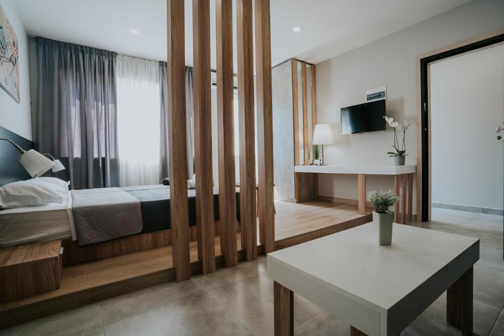 Postel nebo postele na pokoji v ubytování Unique Experience Apartment’s