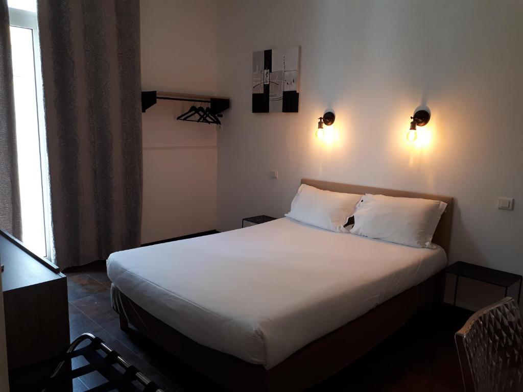 Postel nebo postele na pokoji v ubytování Hotel Marengo