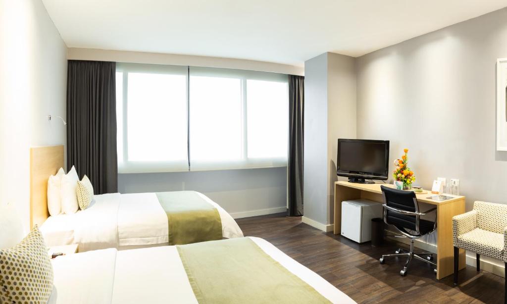TV a/nebo společenská místnost v ubytování Unipark by Oro Verde Hotels