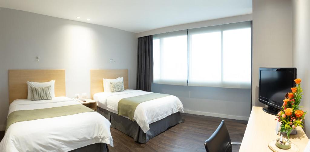 Postel nebo postele na pokoji v ubytování Unipark by Oro Verde Hotels