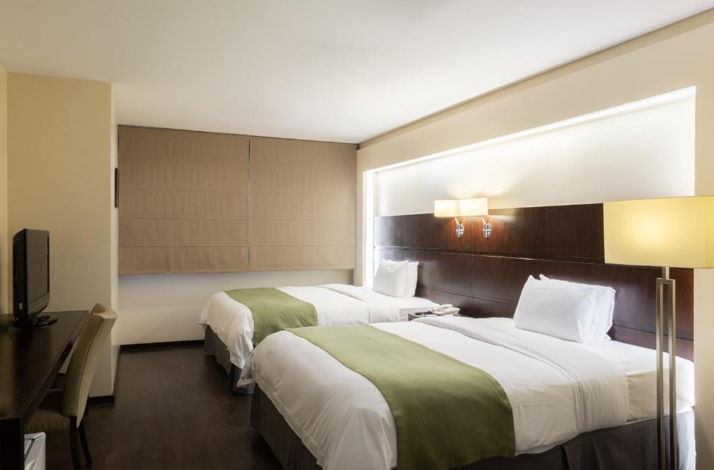 Postel nebo postele na pokoji v ubytování Unipark by Oro Verde Hotels