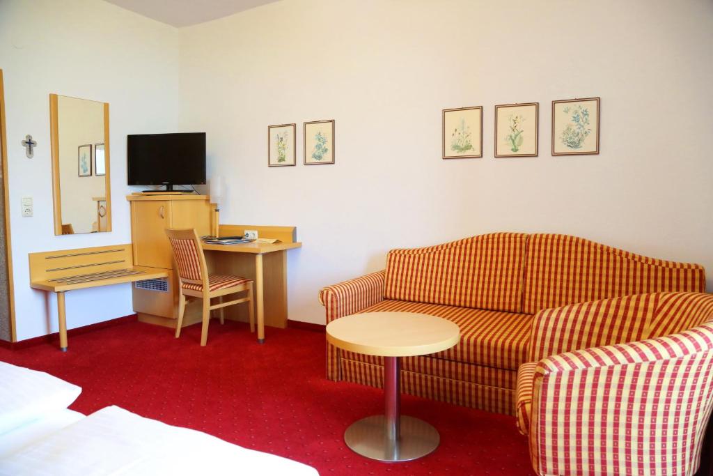 TV o dispositivi per l'intrattenimento presso Seegasthof Hois'n Wirt - Hotel mit Wellnessbereich