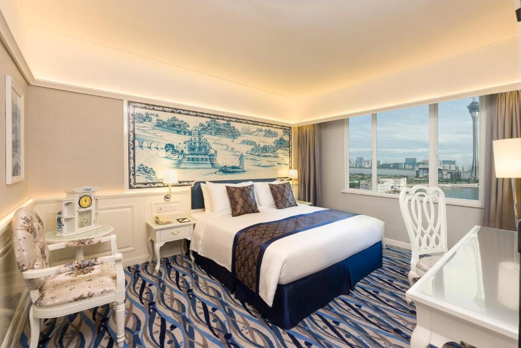 Postel nebo postele na pokoji v ubytování Hotel Riviera Macau