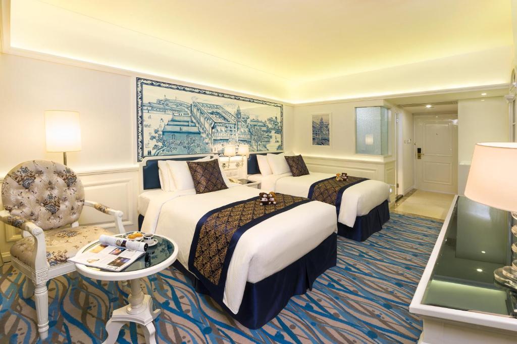 Postel nebo postele na pokoji v ubytování Hotel Riviera Macau
