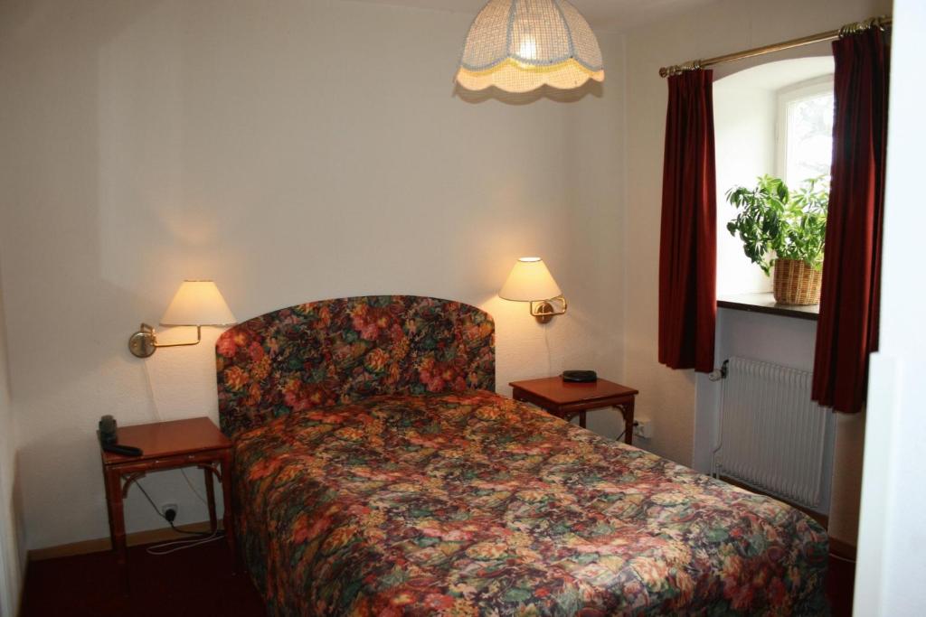 Postel nebo postele na pokoji v ubytování Hotel Chaplin