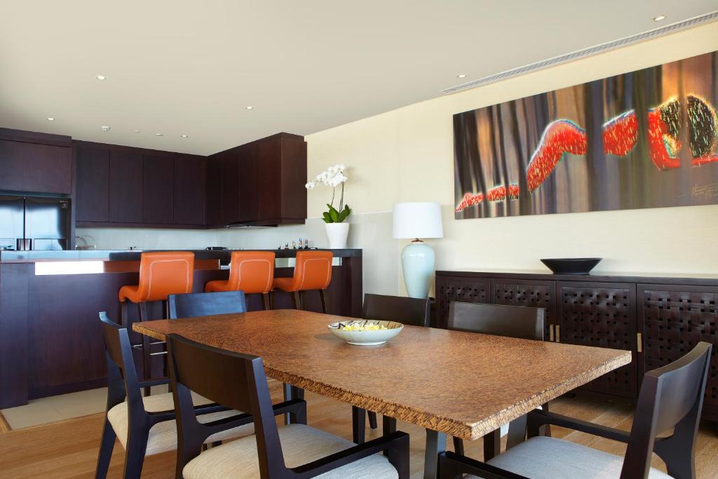 a dining room with a table and chairs at Double - Six, Luxury Hotel - Seminyak in Seminyak