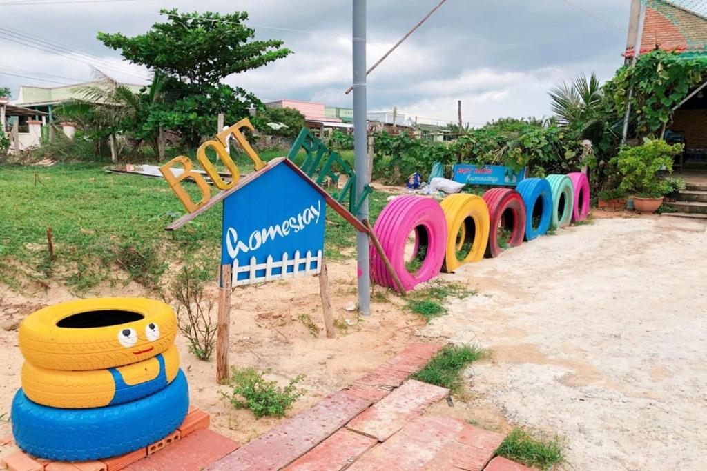 a row of colorful playground equipment in a park at Bot Bien Homestay in Mui Ne