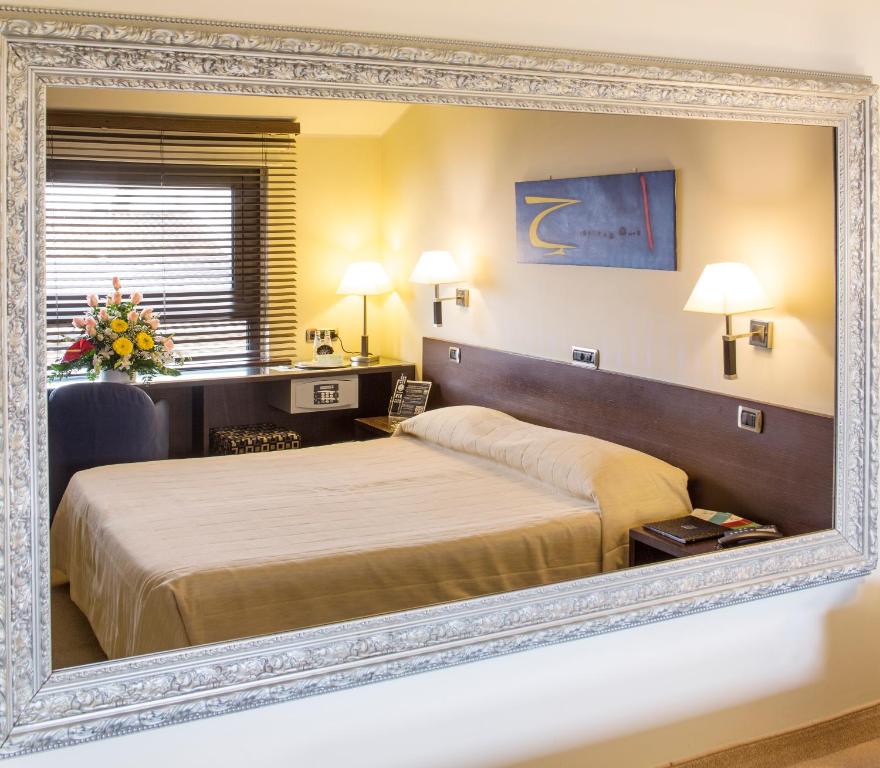 Postel nebo postele na pokoji v ubytování Hotel Motel K