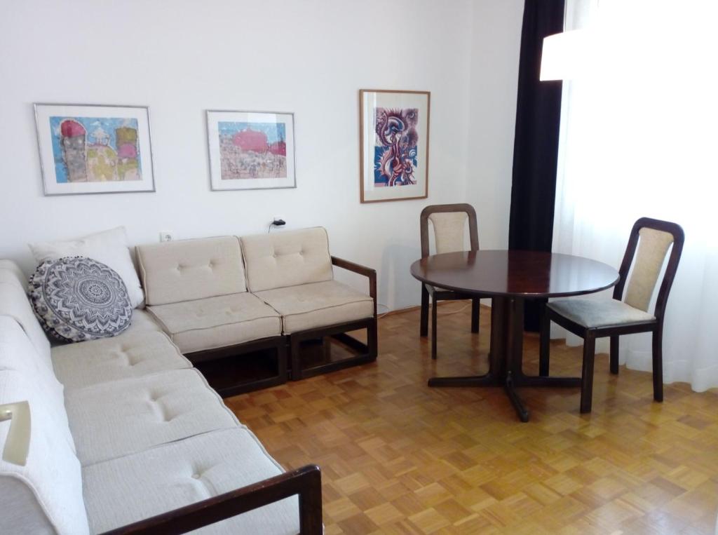 a living room with a couch and a table at Apartment Palas in Banja Luka