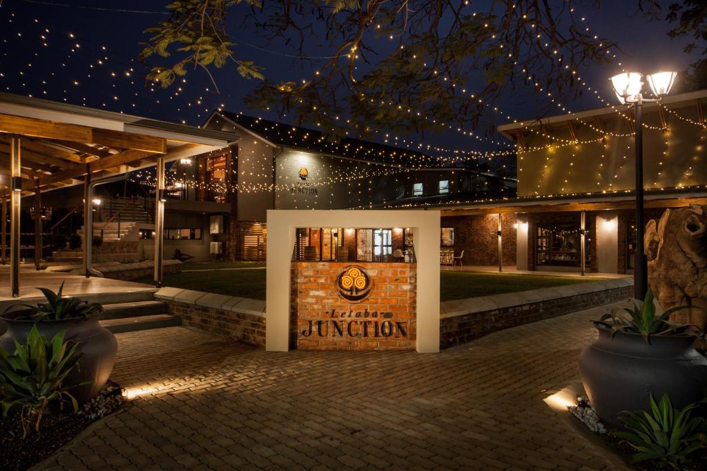 a building with a sign in front of it at night at Letaba Junction Lodge in Letsitele