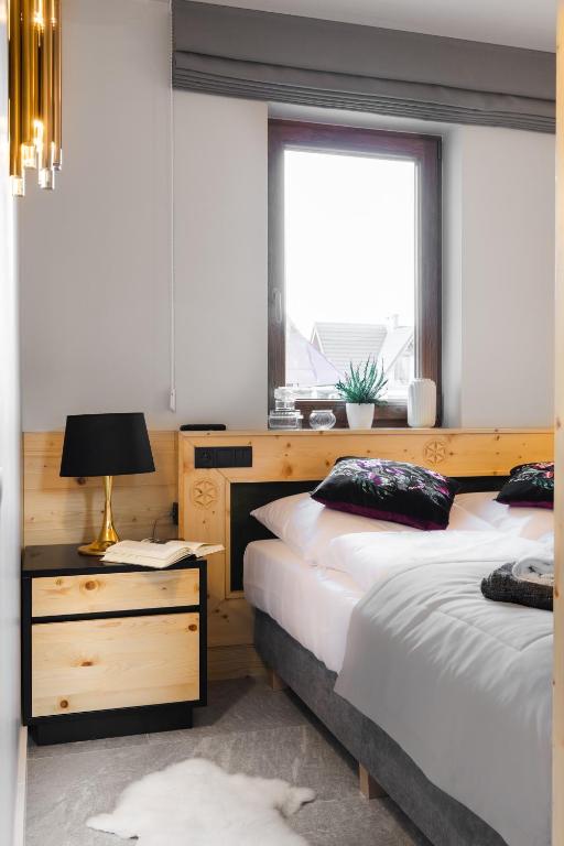 Posteľ alebo postele v izbe v ubytovaní Antałówka Apartments Zakopane