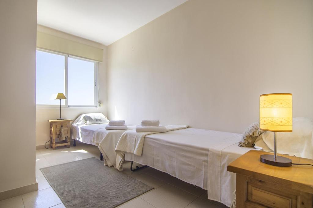 Postel nebo postele na pokoji v ubytování Villas Guzman - Apartamento Bellissimo