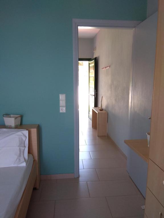 Postel nebo postele na pokoji v ubytování Elina Apartments