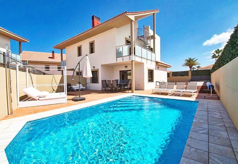 a swimming pool in front of a house at Casa de Marina in San Miguel de Abona