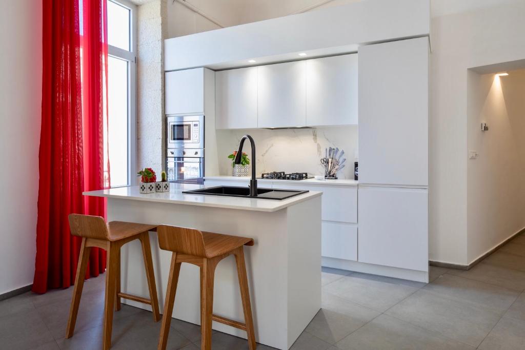 Kuchyňa alebo kuchynka v ubytovaní Ortigia Fab Apartment