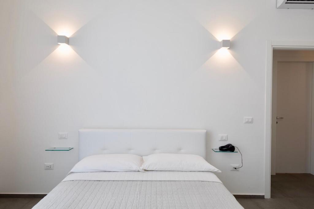 Posteľ alebo postele v izbe v ubytovaní Ortigia Fab Apartment