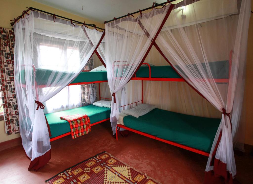 Postel nebo postele na pokoji v ubytování Red Chilli Hideaway