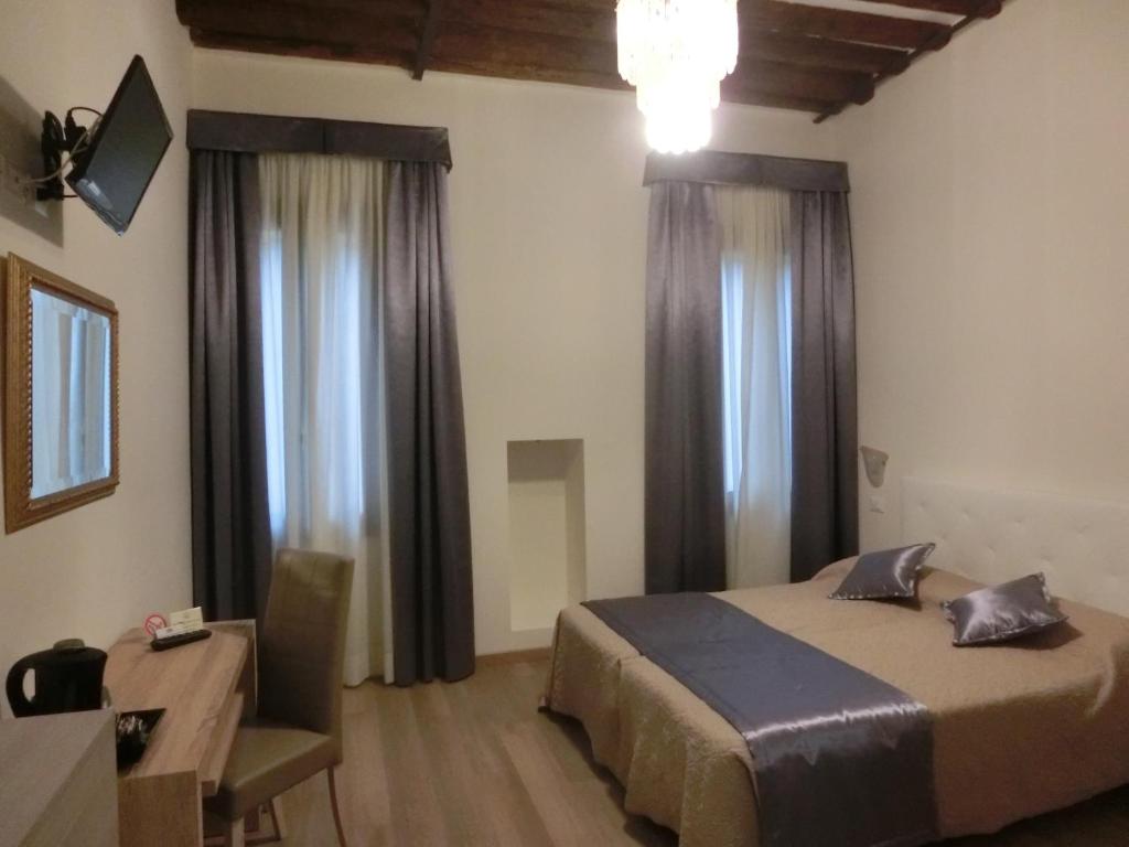 Postel nebo postele na pokoji v ubytování Locanda Ca' Lucrezia