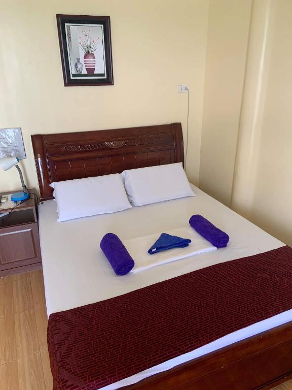 Postel nebo postele na pokoji v ubytování Sascha's Resort Oslob