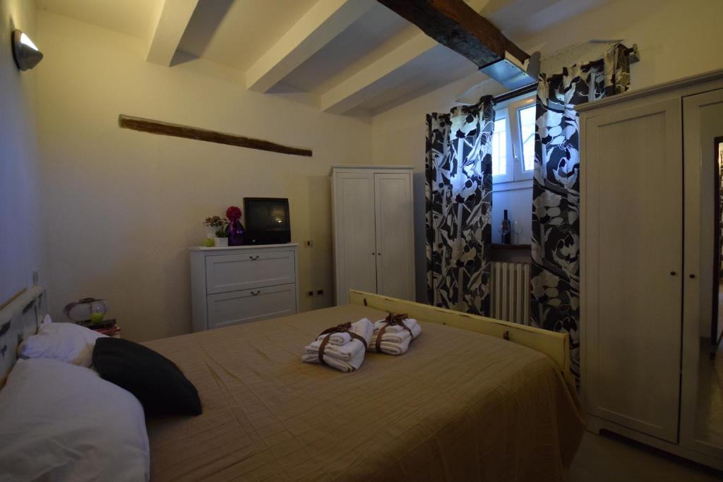 A bed or beds in a room at Rosa Malatestiana