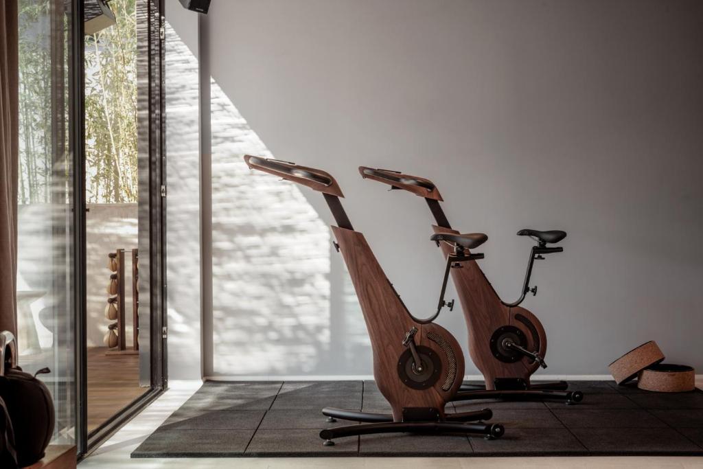 a wooden scooter is parked in a room at OKU Ibiza in San Antonio