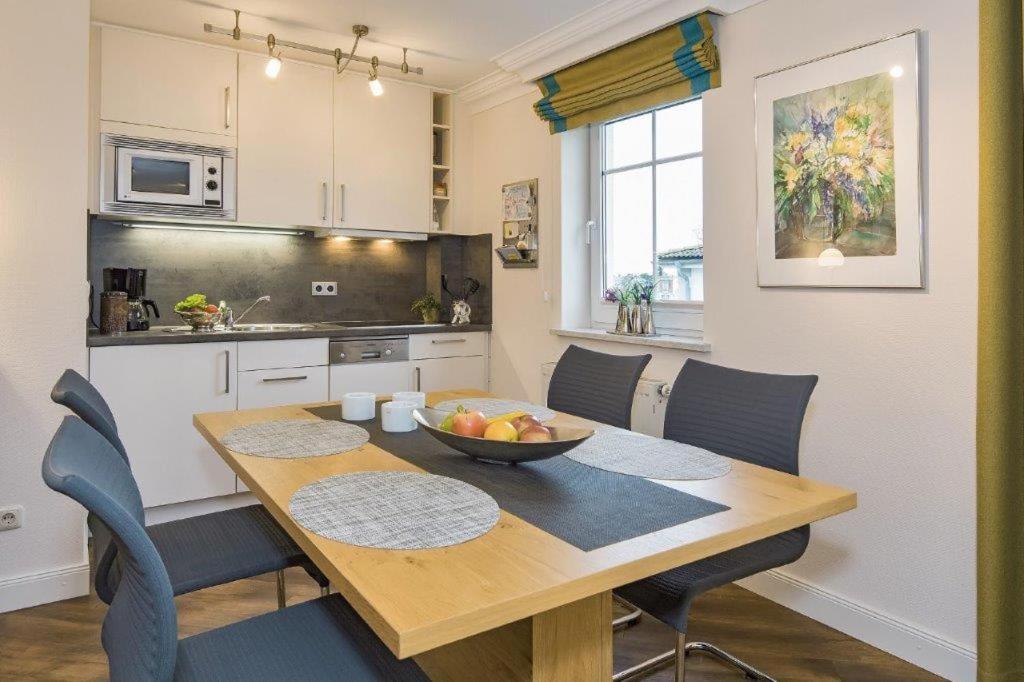 a kitchen with a table with a bowl of fruit on it at Villa Waldstr. App 14 in Bansin