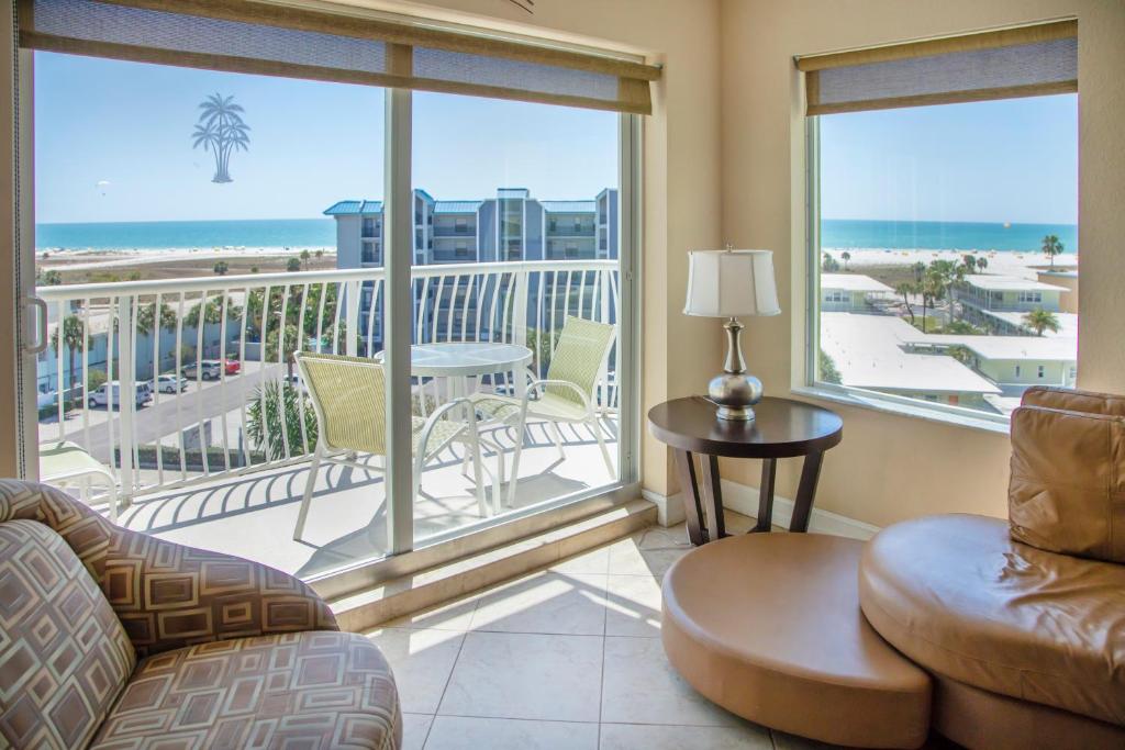 a living room with a view of the ocean at Crystal Palms Beach Resort in St Pete Beach