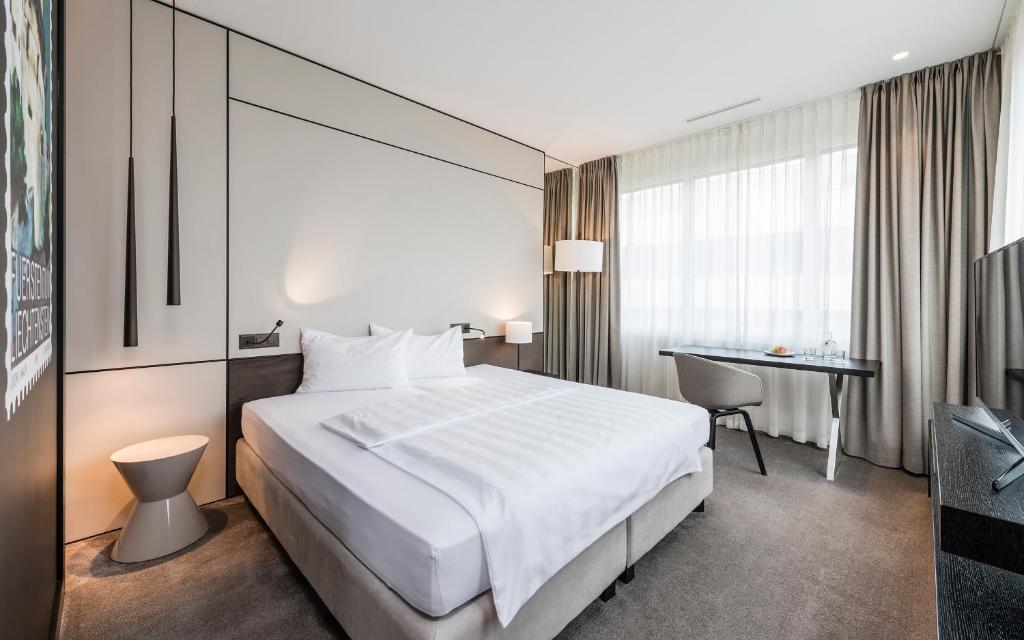 Postel nebo postele na pokoji v ubytování b-smart hotel Bendern