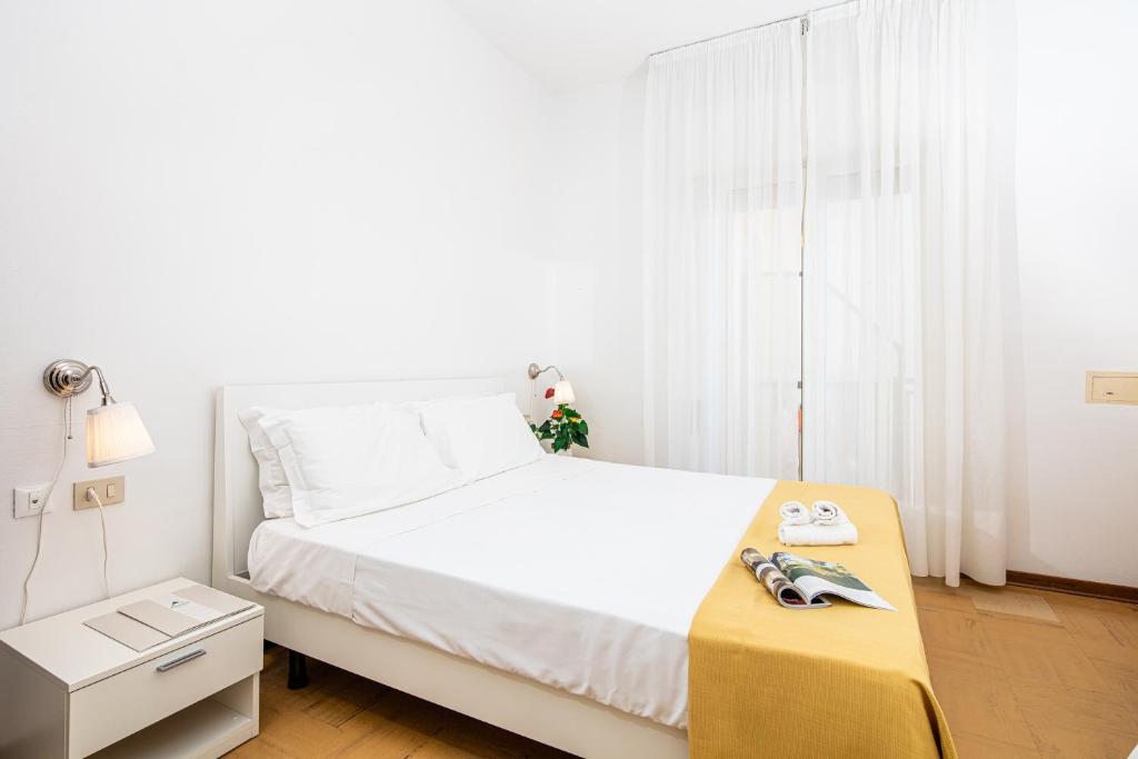 Postel nebo postele na pokoji v ubytování Hotel Astor