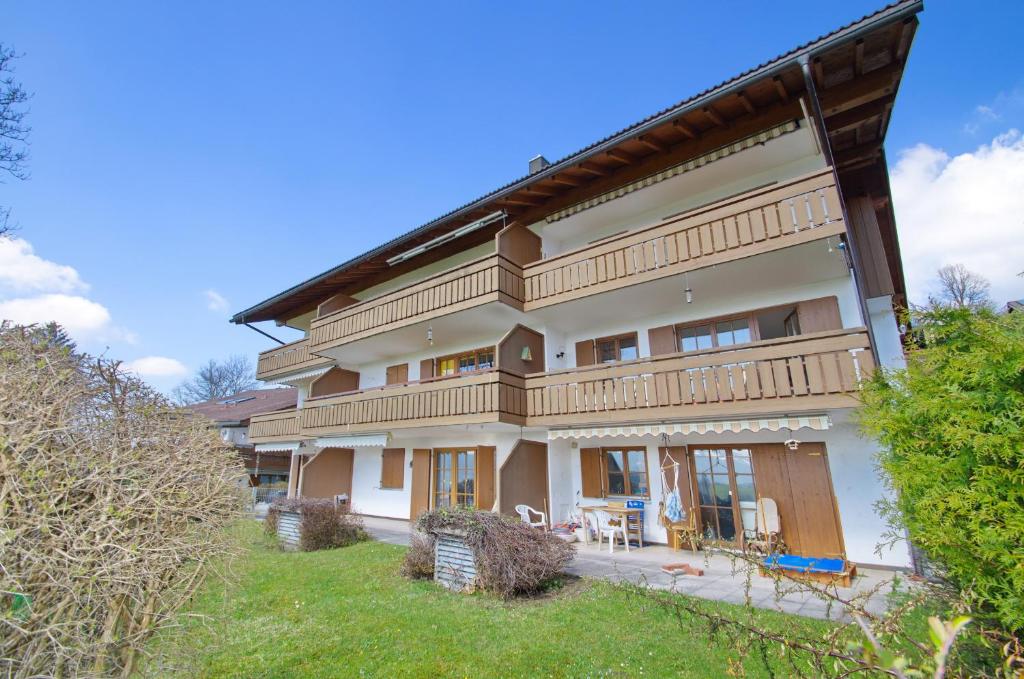 a large house with balconies and a yard at Bildstöckle in Sonthofen