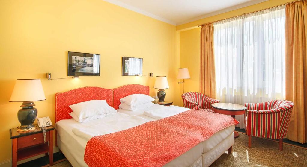 Postel nebo postele na pokoji v ubytování Dvorak Spa & Wellness