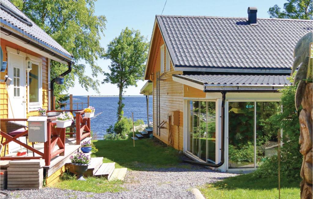 a house with a view of the water at Gorgeous Apartment In Holmsund With Sauna in Holmsund