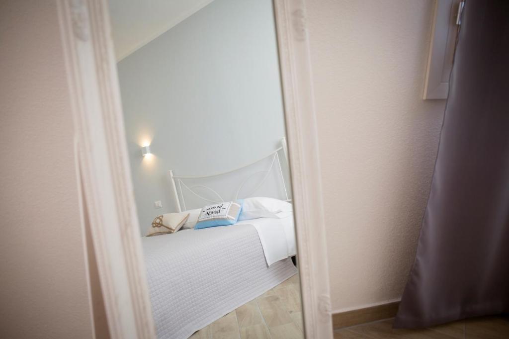 Postel nebo postele na pokoji v ubytování Luca's Rooms