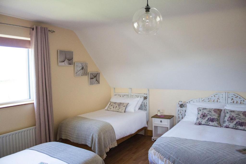 Postel nebo postele na pokoji v ubytování Madra Rua Organic Accommodation