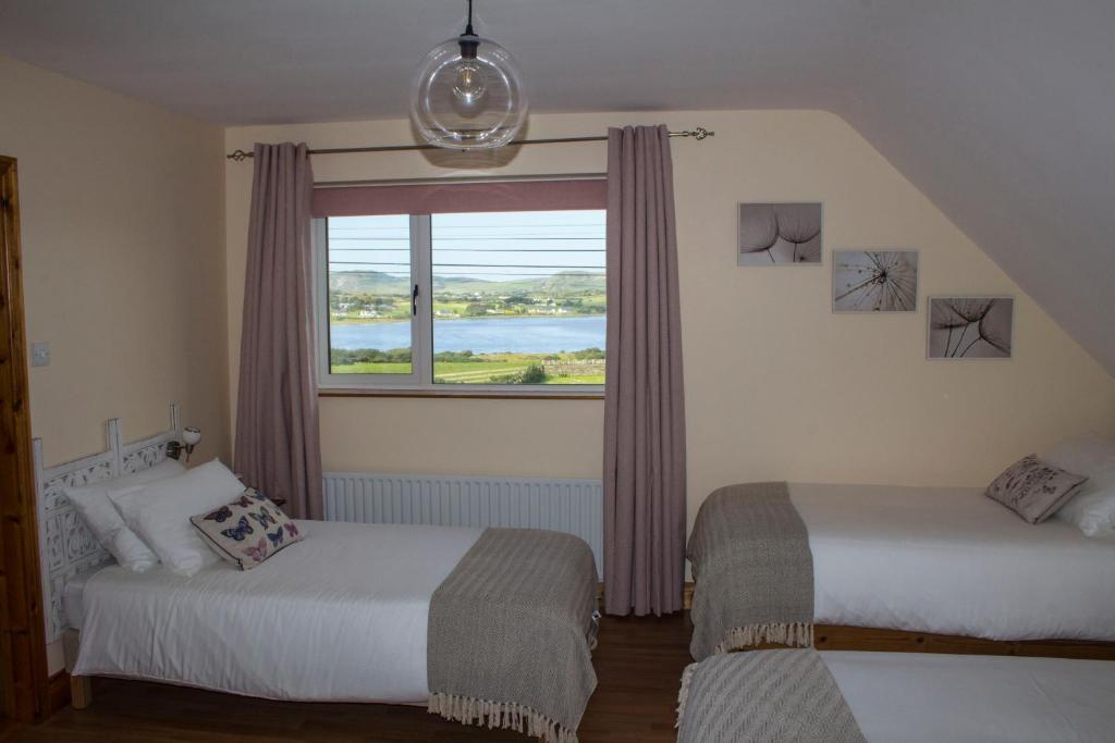 Postel nebo postele na pokoji v ubytování Madra Rua Organic Accommodation