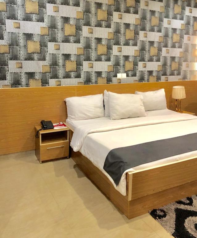 Postel nebo postele na pokoji v ubytování Fawzy Hotel
