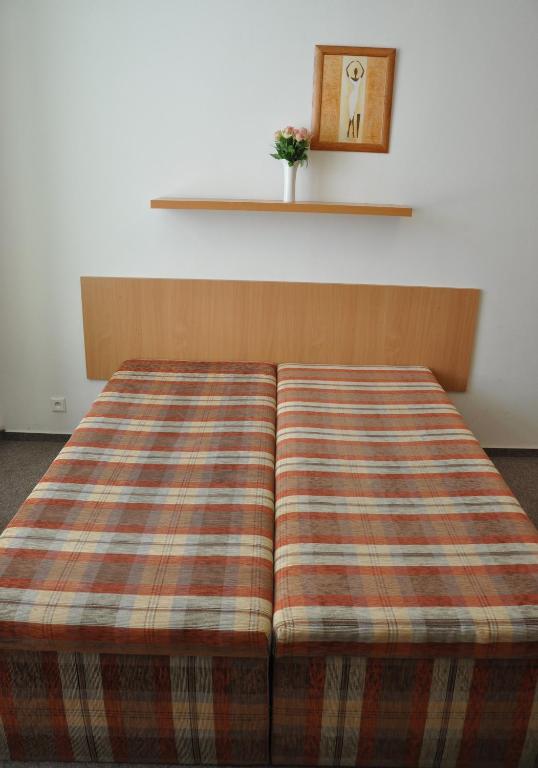 Postel nebo postele na pokoji v ubytování Hotel Děčín