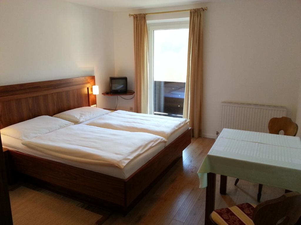 Postel nebo postele na pokoji v ubytování Rupertihof