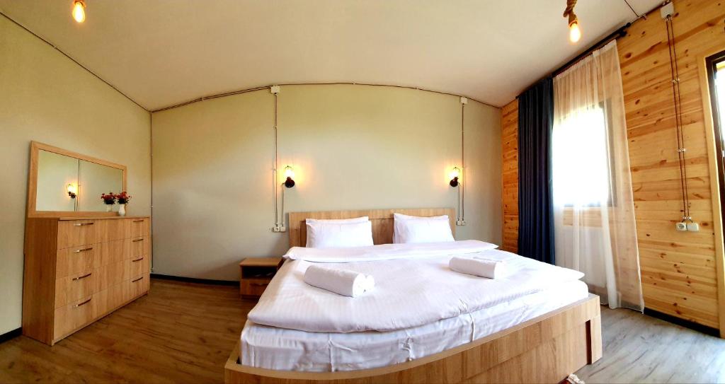 Letto o letti in una camera di Hotel Migu Yard