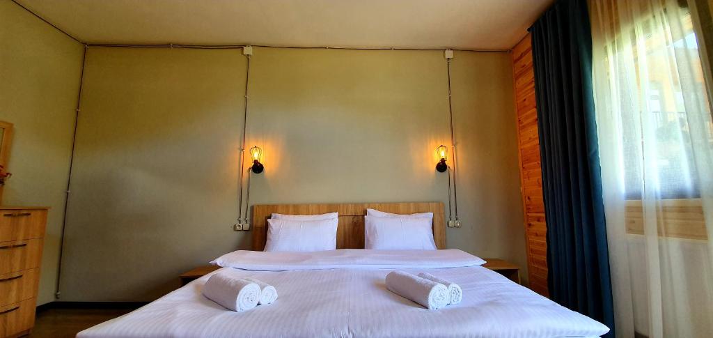 Letto o letti in una camera di Hotel Migu Yard