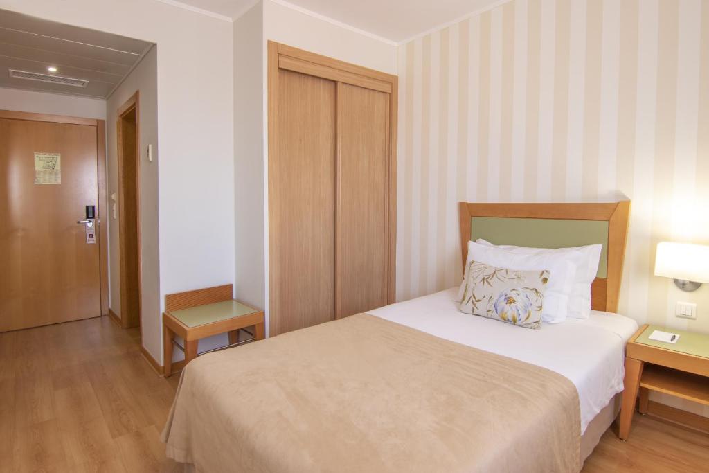Кровать или кровати в номере Luna Esperanca Centro Hotel