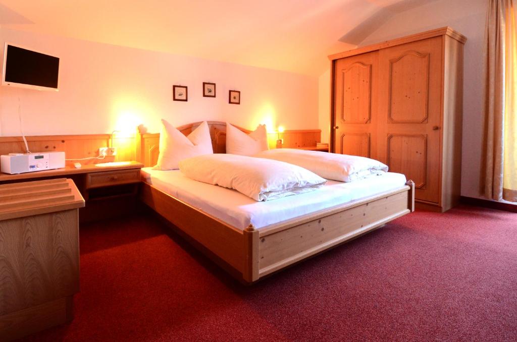 Postel nebo postele na pokoji v ubytování Haus Magdalena