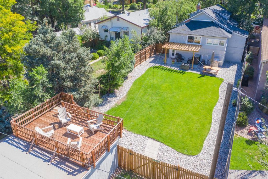 an aerial view of a backyard with a lawn at *H NEW!* 4BR Centrally Located Lifestyle Bungalow in Colorado Springs