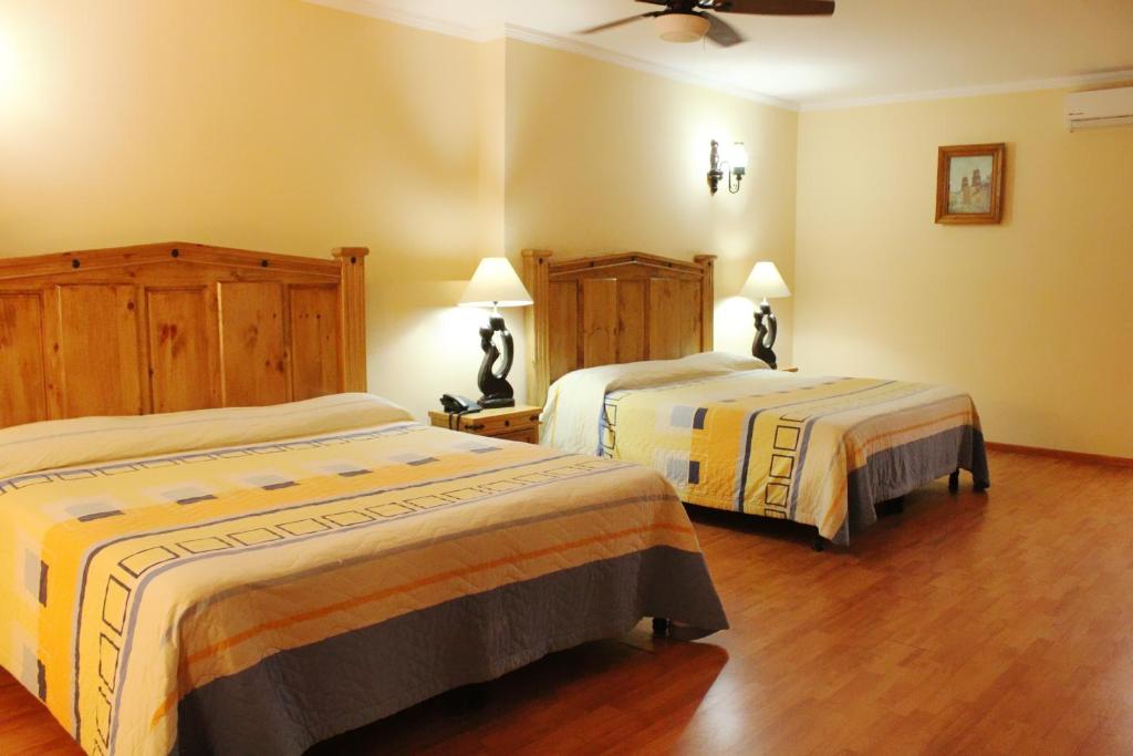 Ένα ή περισσότερα κρεβάτια σε δωμάτιο στο Meson de la Merced