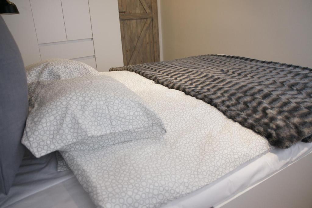 Posteľ alebo postele v izbe v ubytovaní Apartament na starówce Toruń